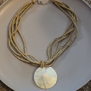 Multi-Strand Beige Beaded Necklace with Mother-of-Pearl Pendant